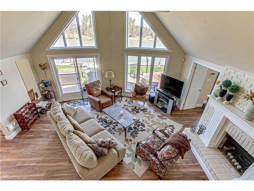 7474 Riverside Drive, Port Franks, ON - Indoor Photo Showing Living Room With Fireplace
