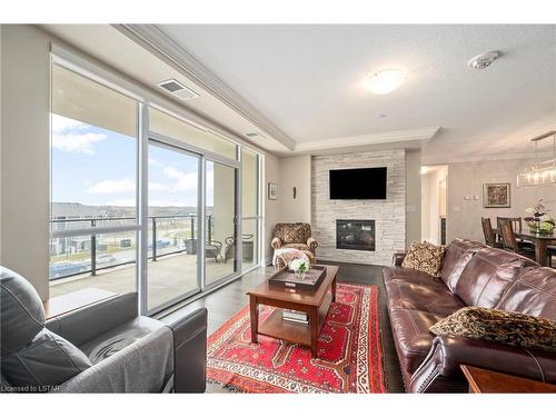 309-260 Villagewalk Boulevard, London, ON - Indoor Photo Showing Living Room With Fireplace