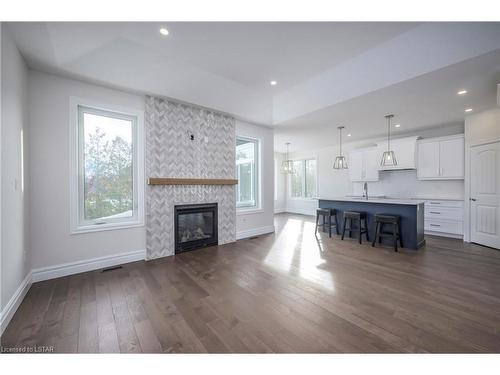 61 Arrowwood Path, Ilderton, ON - Indoor Photo Showing Living Room With Fireplace
