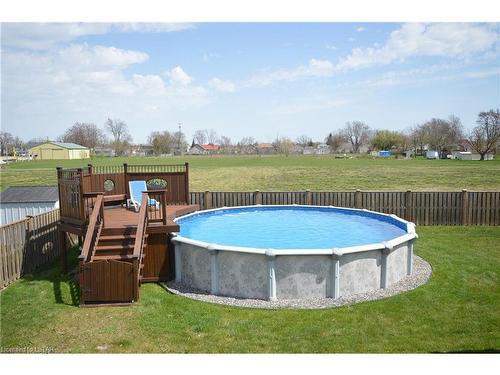 8105 Mcgregor Court, Mcgregor, ON - Outdoor With Above Ground Pool With Backyard