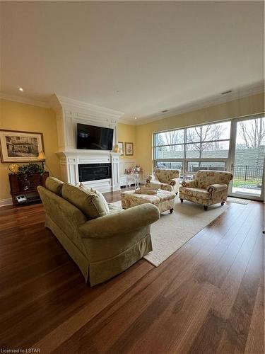 111-1705 Fiddlehead Place, London, ON - Indoor Photo Showing Living Room With Fireplace