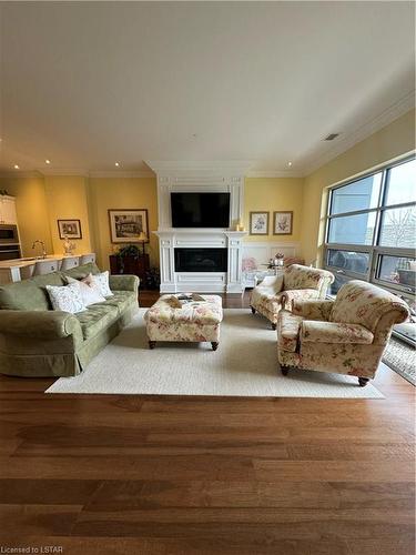 111-1705 Fiddlehead Place, London, ON - Indoor Photo Showing Living Room With Fireplace