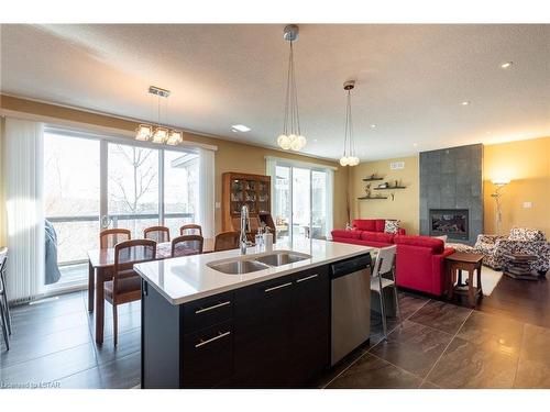 334 Grasslands Way, London, ON - Indoor Photo Showing Kitchen With Fireplace With Double Sink