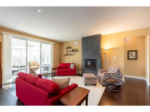 334 Grasslands Way, London, ON - Indoor Photo Showing Living Room With Fireplace