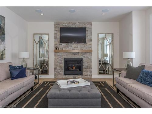 142 Harvest Lane, Dorchester, ON - Indoor Photo Showing Living Room With Fireplace