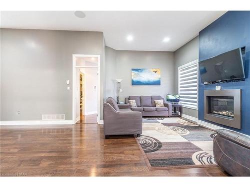 30 Riness Drive, Dorchester, ON - Indoor Photo Showing Living Room With Fireplace