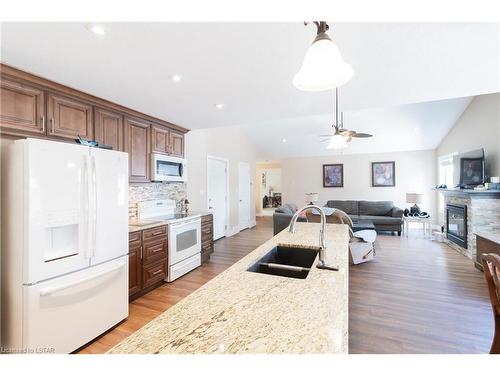 8 Queens Avenue, Grand Bend, ON - Indoor Photo Showing Kitchen With Fireplace With Double Sink