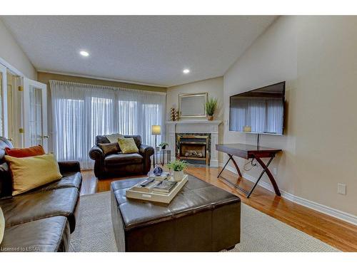 21-1755 Louise Boulevard, London, ON - Indoor Photo Showing Living Room With Fireplace