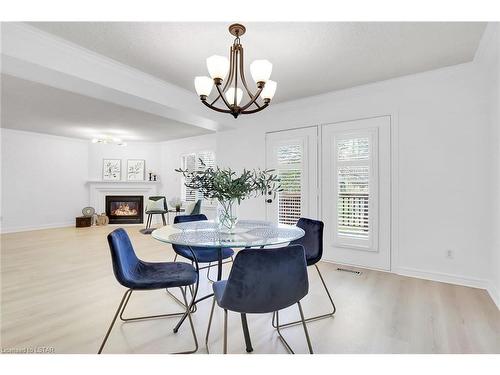 44-410 Ambleside Drive, London, ON - Indoor Photo Showing Dining Room With Fireplace