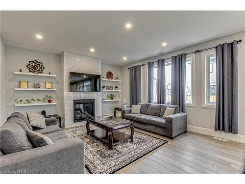 98 Locky Lane, Komoka, ON - Indoor Photo Showing Living Room With Fireplace