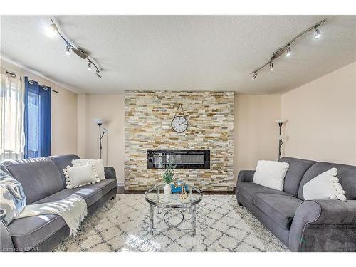 3382 Emilycarr Lane, London, ON - Indoor Photo Showing Living Room With Fireplace