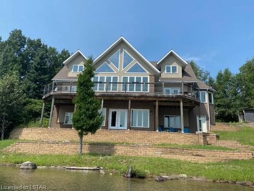 61 Kakagi Lake Road, Nestor Falls, ON - Outdoor With Body Of Water With Deck Patio Veranda With Facade