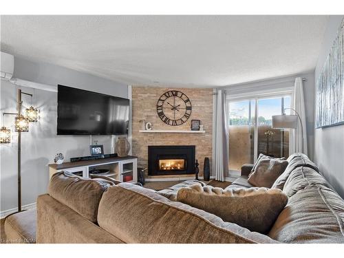 120-725 Deveron Crescent, London, ON - Indoor Photo Showing Living Room With Fireplace