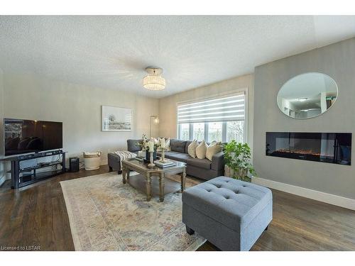 2340 Meadowgate Boulevard, London, ON - Indoor Photo Showing Living Room With Fireplace