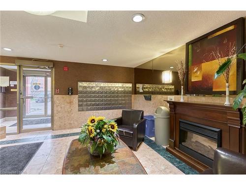 702-95 Base Line Road W, London, ON - Indoor With Fireplace