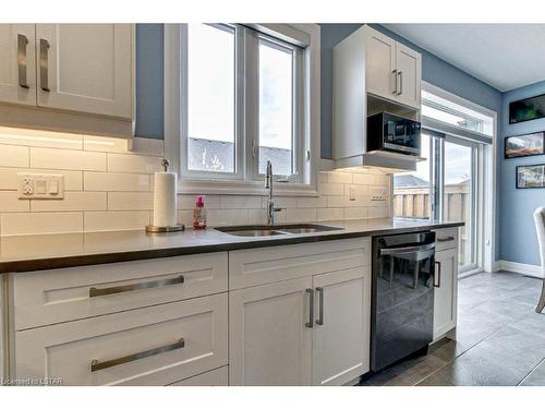418-9861 Glendon Drive, Komoka, ON - Indoor Photo Showing Kitchen With Double Sink