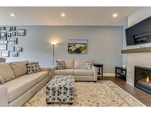 418-9861 Glendon Drive, Komoka, ON - Indoor Photo Showing Living Room With Fireplace