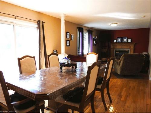 154 Kingfisher Avenue, Woodstock, ON - Indoor Photo Showing Dining Room With Fireplace