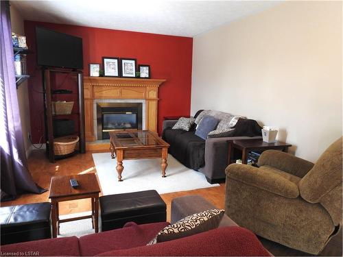 154 Kingfisher Avenue, Woodstock, ON - Indoor Photo Showing Living Room With Fireplace
