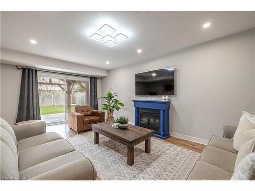 1541 Devos Drive, London, ON - Indoor Photo Showing Living Room With Fireplace