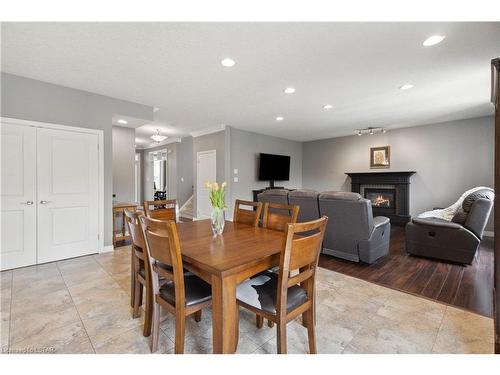 1750 Tigerlily Road, London, ON - Indoor Photo Showing Dining Room With Fireplace