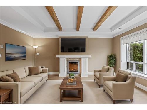 102-340 Sugarcreek Trail, London, ON - Indoor Photo Showing Living Room With Fireplace