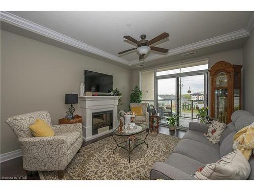 302-240 Village Walk Boulevard, London, ON - Indoor Photo Showing Living Room With Fireplace
