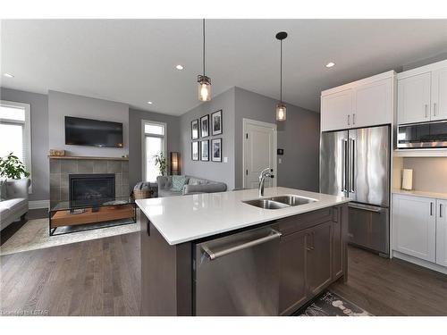 50-555 Sunningdale Road, London, ON - Indoor Photo Showing Kitchen With Fireplace With Stainless Steel Kitchen With Double Sink With Upgraded Kitchen