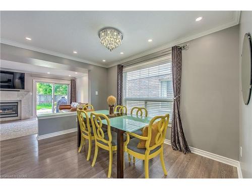 1845 Mickleborough Drive, London, ON - Indoor Photo Showing Dining Room With Fireplace