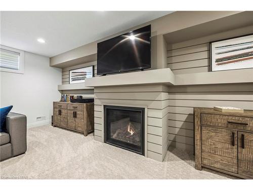 11-1170 Riverbend Road Road, London, ON - Indoor Photo Showing Basement With Fireplace