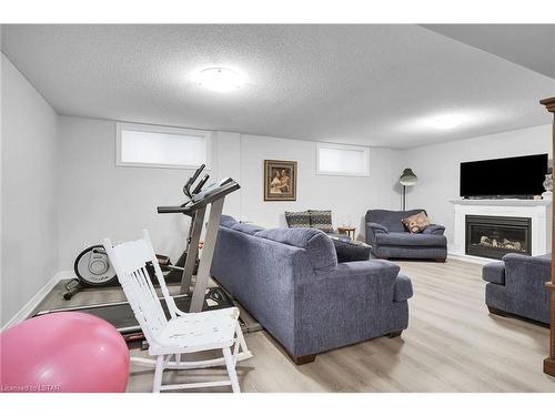 80-1100 Byron Baseline Road, London, ON - Indoor Photo Showing Gym Room With Fireplace