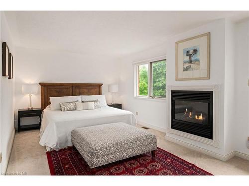 43 Ravine Ridge Way, London, ON - Indoor Photo Showing Bedroom With Fireplace
