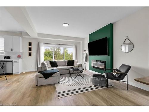 6885 Royal Magnolia Avenue, London, ON - Indoor Photo Showing Living Room With Fireplace