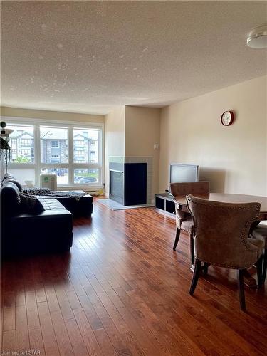 309-1 Jacksway Crescent, London, ON - Indoor Photo Showing Living Room With Fireplace