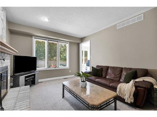 504 Sunnyside Crescent, London, ON - Indoor Photo Showing Living Room With Fireplace