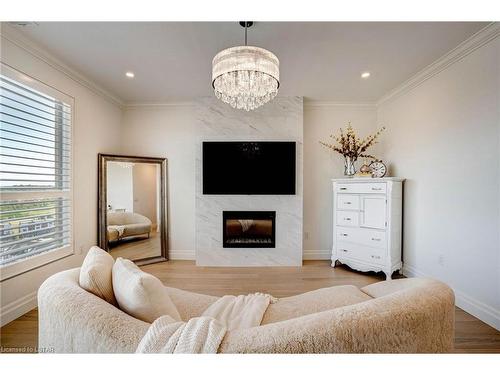 1103-260 Villagewalk Boulevard, London, ON - Indoor Photo Showing Living Room With Fireplace