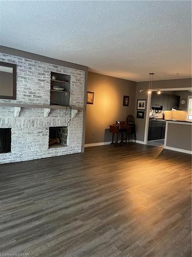 710 Wonderland Road S, London, ON - Indoor With Fireplace
