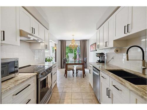 12-601 Grenfell Drive, London, ON - Indoor Photo Showing Kitchen With Double Sink With Upgraded Kitchen