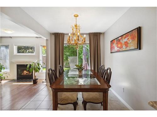 12-601 Grenfell Drive, London, ON - Indoor Photo Showing Dining Room With Fireplace