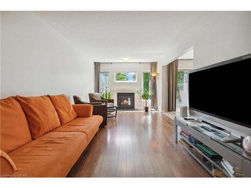 12-601 Grenfell Drive, London, ON - Indoor Photo Showing Living Room With Fireplace
