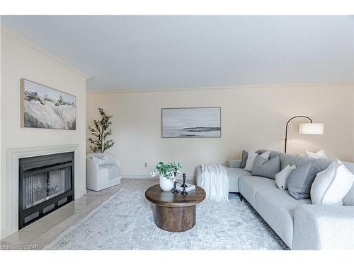 17-65 Fiddlers Green Road, London, ON - Indoor Photo Showing Living Room With Fireplace