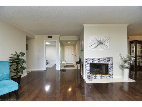 Ph3-150 Wilson Street W, Ancaster, ON - Indoor Photo Showing Living Room With Fireplace