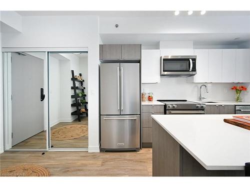 A907-3210 Dakota Common, Burlington, ON - Indoor Photo Showing Kitchen With Stainless Steel Kitchen With Double Sink