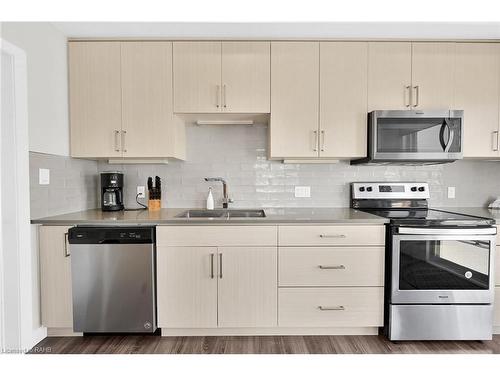 904 West Village Square, London, ON - Indoor Photo Showing Kitchen With Stainless Steel Kitchen With Double Sink