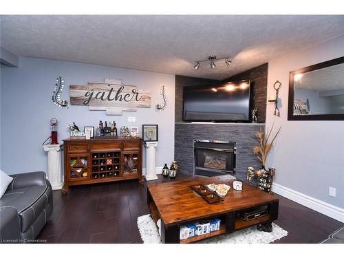 100 Stone Church Road E, Hamilton, ON - Indoor Photo Showing Living Room With Fireplace