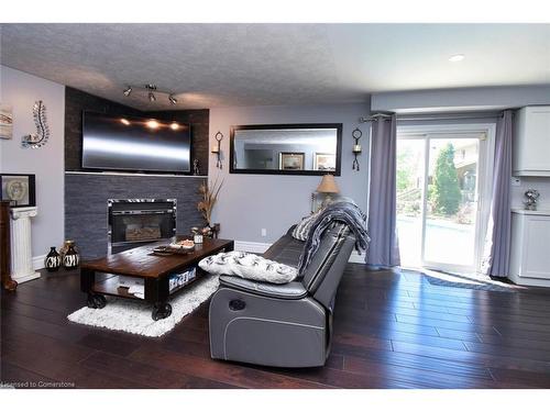 100 Stone Church Road E, Hamilton, ON - Indoor Photo Showing Living Room With Fireplace