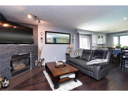 100 Stone Church Road E, Hamilton, ON - Indoor Photo Showing Living Room With Fireplace