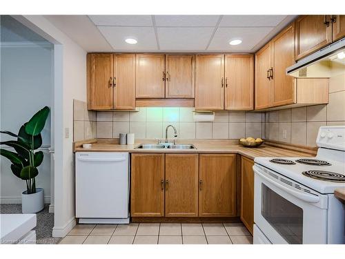 318-150 Wilson Street W, Ancaster, ON - Indoor Photo Showing Kitchen With Double Sink