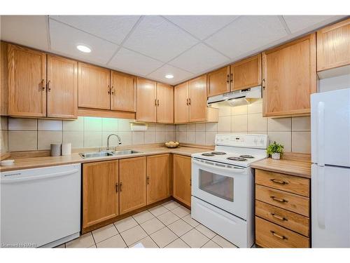 318-150 Wilson Street W, Ancaster, ON - Indoor Photo Showing Kitchen With Double Sink