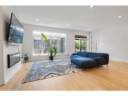 36-8974 Willoughby Drive, Niagara Falls, ON - Indoor Photo Showing Living Room With Fireplace